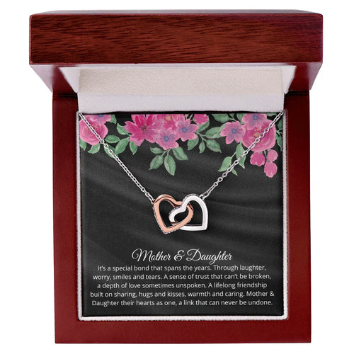 Gift for Daughter Necklace featuring two intertwined hearts in silver and rose gold in elegant wooden box