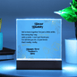 Someone Said Gift acrylic square plaque with Father's Day message and wooden base glowing on blue background