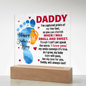 Daddy acrylic plaque with blue and orange baby footprints and heartfelt Father's Day message on wooden base
