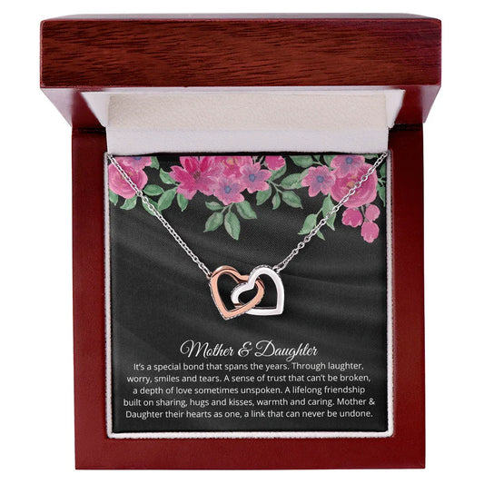 Gift for Daughter Necklace featuring two intertwined hearts in silver and rose gold in elegant wooden box