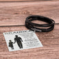 Black leather bracelet with cross charm gift for grandfather bracelet displayed on wooden surface with grandfather poem card