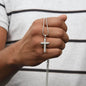Silver cross necklace held in hand gift for grandfather bracelet by Someone Said Gift