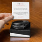 Gift for Grandson Bracelet in black leather with cross charm displayed on a black box with a message card