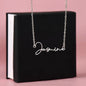 Silver signature name necklace spelling Jasmine hanging over black box gift for her signature name necklace