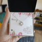 Gift for Mom Necklace by Someone Said Gift with a silver heart-shaped pendant in a floral Mother's Day gift box