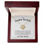 Gift for Wife Love Knot Necklace in gold with a sparkling center stone displayed in a wooden gift box