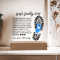 Acrylic gift idea for a dad with heartfelt message and blue baby footprint on wooden stand