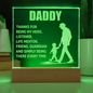 Acrylic gift idea for a dad with illuminated message and silhouette of father and child on wooden base