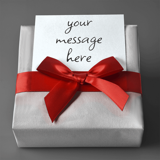 Gift Wrap with silver paper and red ribbon tied in a bow with a customizable message card