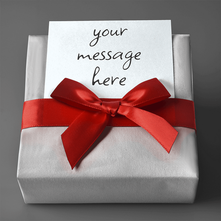 Gift Wrap with silver paper and red ribbon tied in a bow with a customizable message card