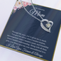 Silver heart pendant with crystal on chain displayed on navy floral message card to my amazing mom necklace