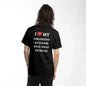 Black I Love My Girlfriend T Shirt with white text and red heart worn by a person from the back