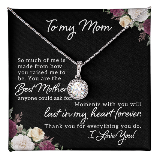 Sparkling round halo pendant on silver chain personalized mother necklace displayed on floral gift card with heartfelt mom message