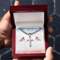Silver necklace and cross pendant with chain in wooden gift box featuring American flag background