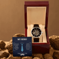 Skeleton dial watch with leather strap in a wooden box featuring a sentimental value where to watch Father's Day card