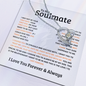 Tiffany's necklace heart pendant on a silver chain displayed over a soulmate love message card