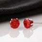 Someone Said Gift red Zirconia Earrings with silver prong setting on reflective surface